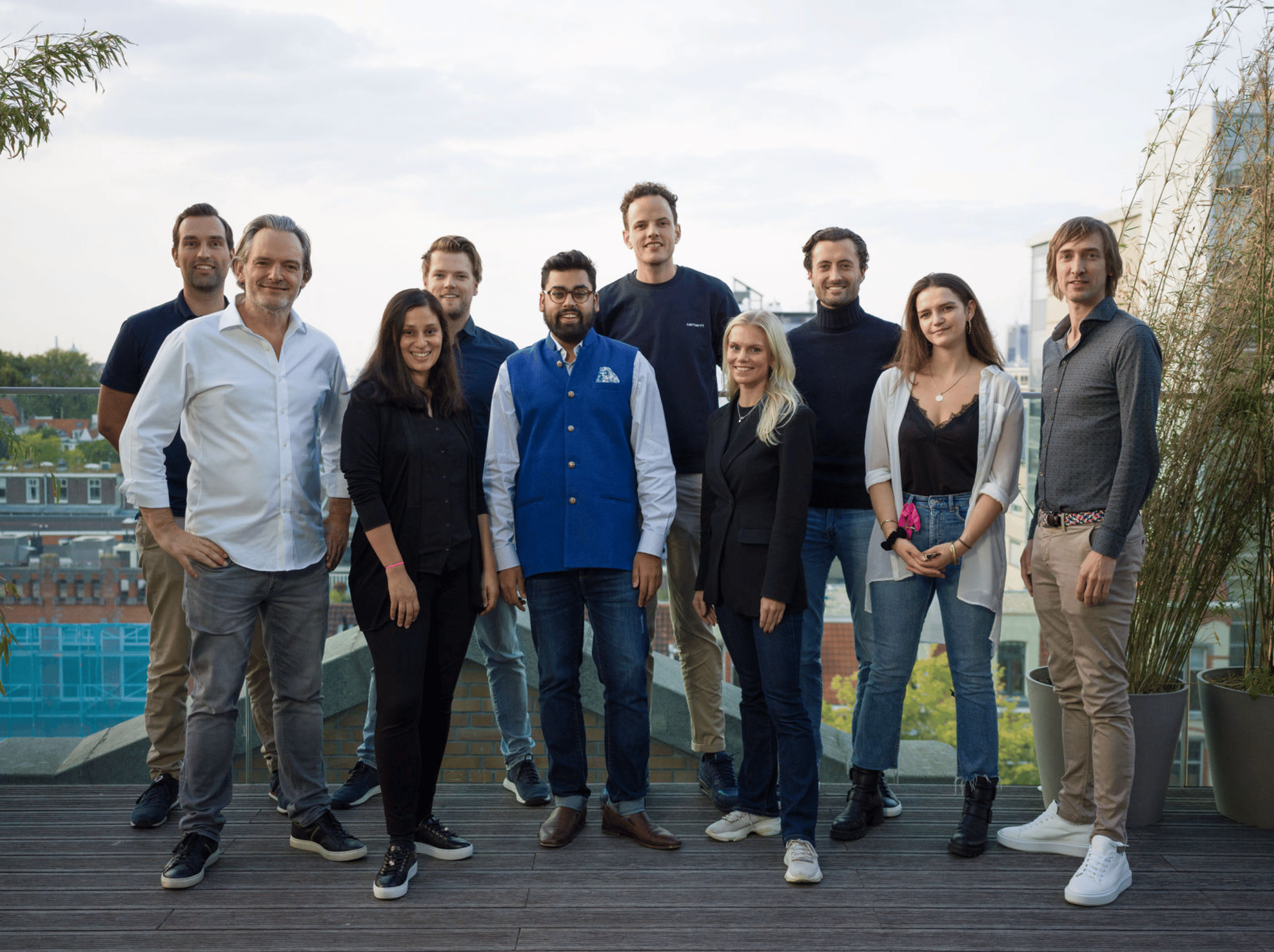 A landscape photo of the Peak Capital team