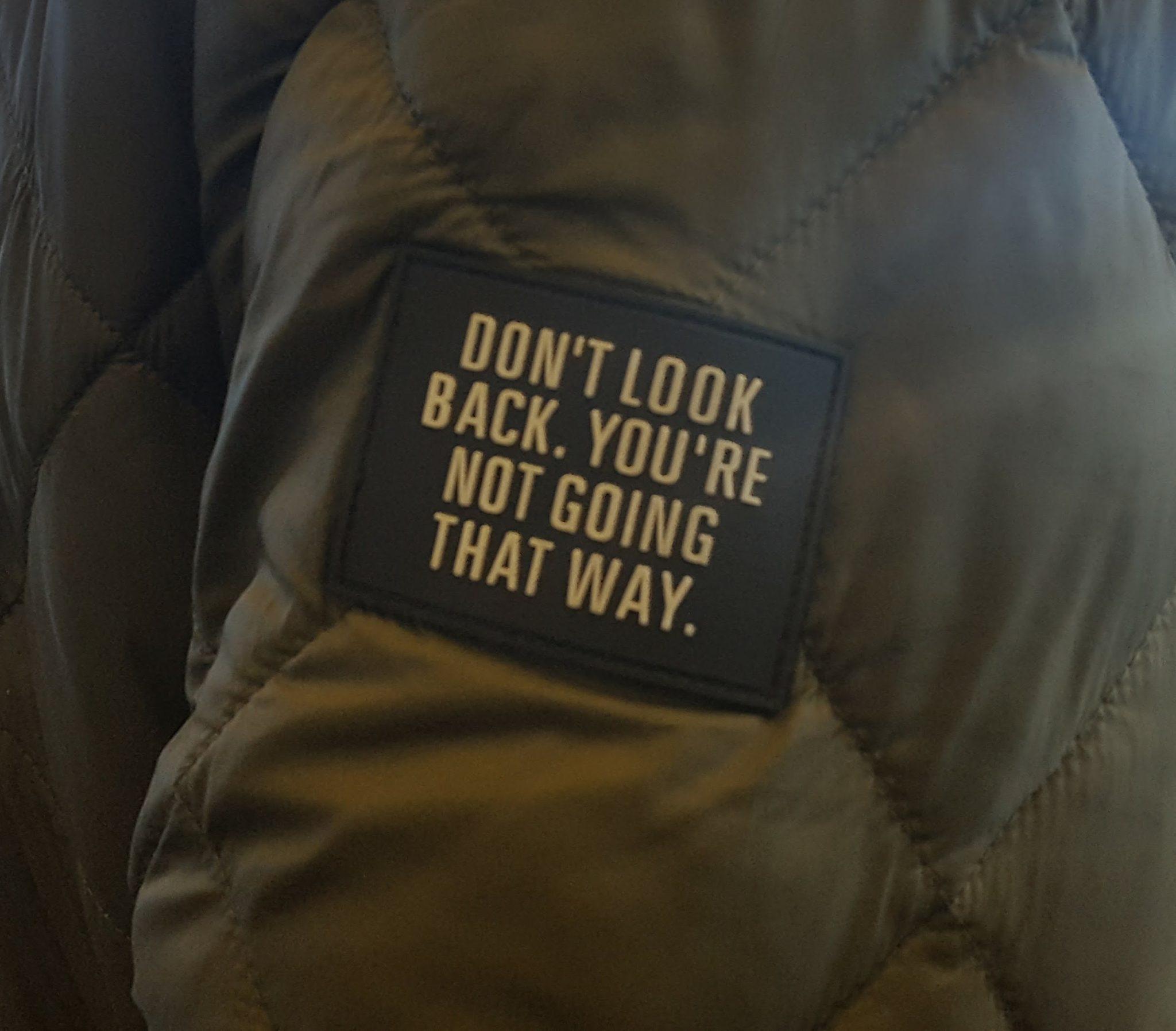 “I took the attached picture years ago at an airport (a man was wearing a jacket with a patch). It helps me keep moving forward in my own creative journey and in my career. It could help others who were laid off stay positive and focus on what's ahead.”