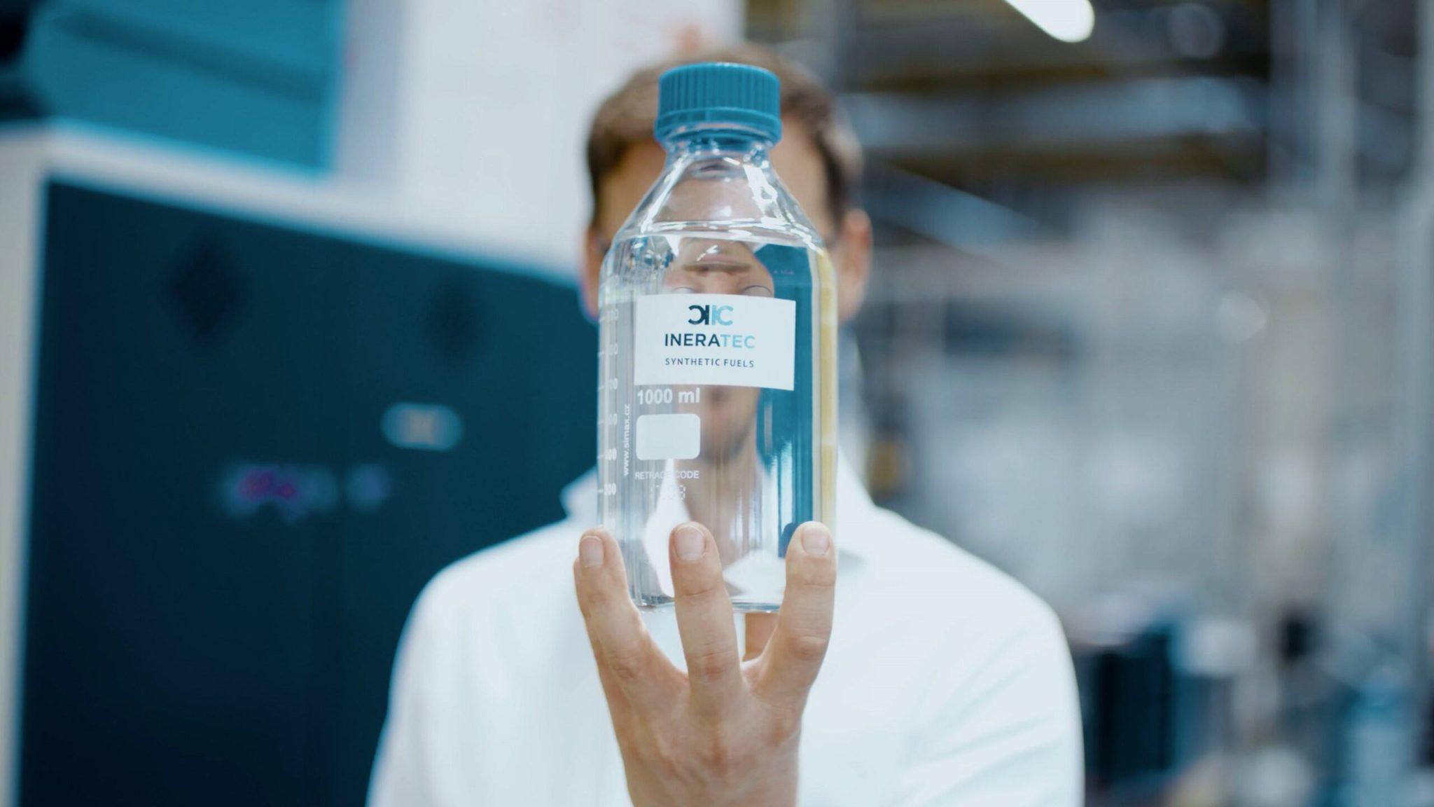 Someone holding a bottle of Ineratec's synthetic fuel