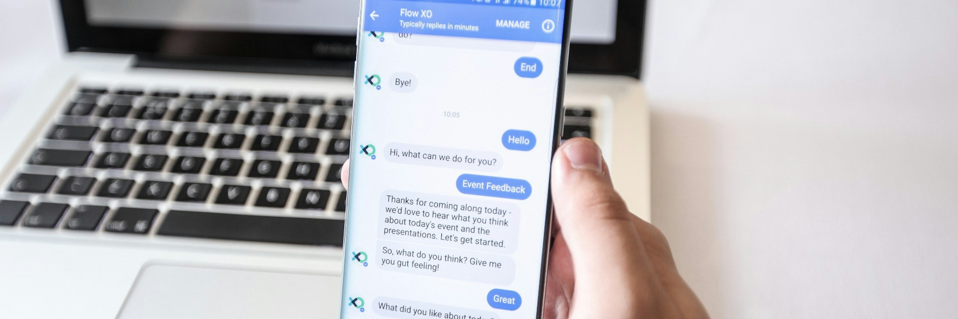 Person interacti chatbot conversation on mobile.