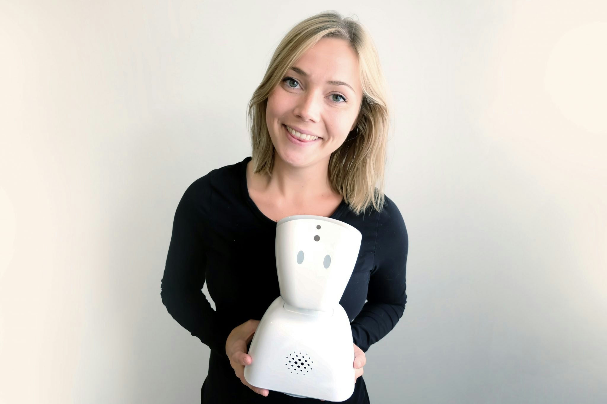 Karen Dolva with No Isolation's AV1 robot.
