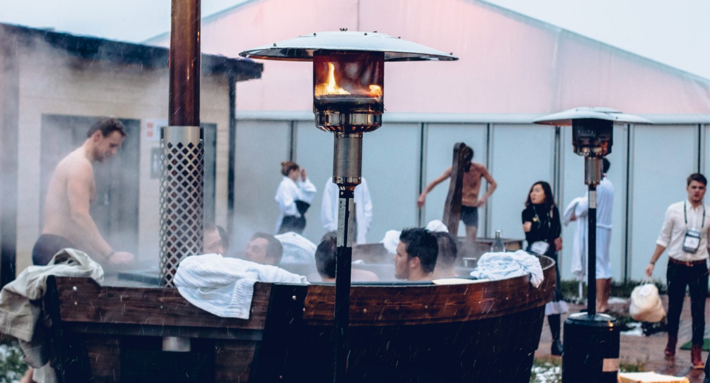 Image of men steaming in an open air sauna during a tech conference sauna party 