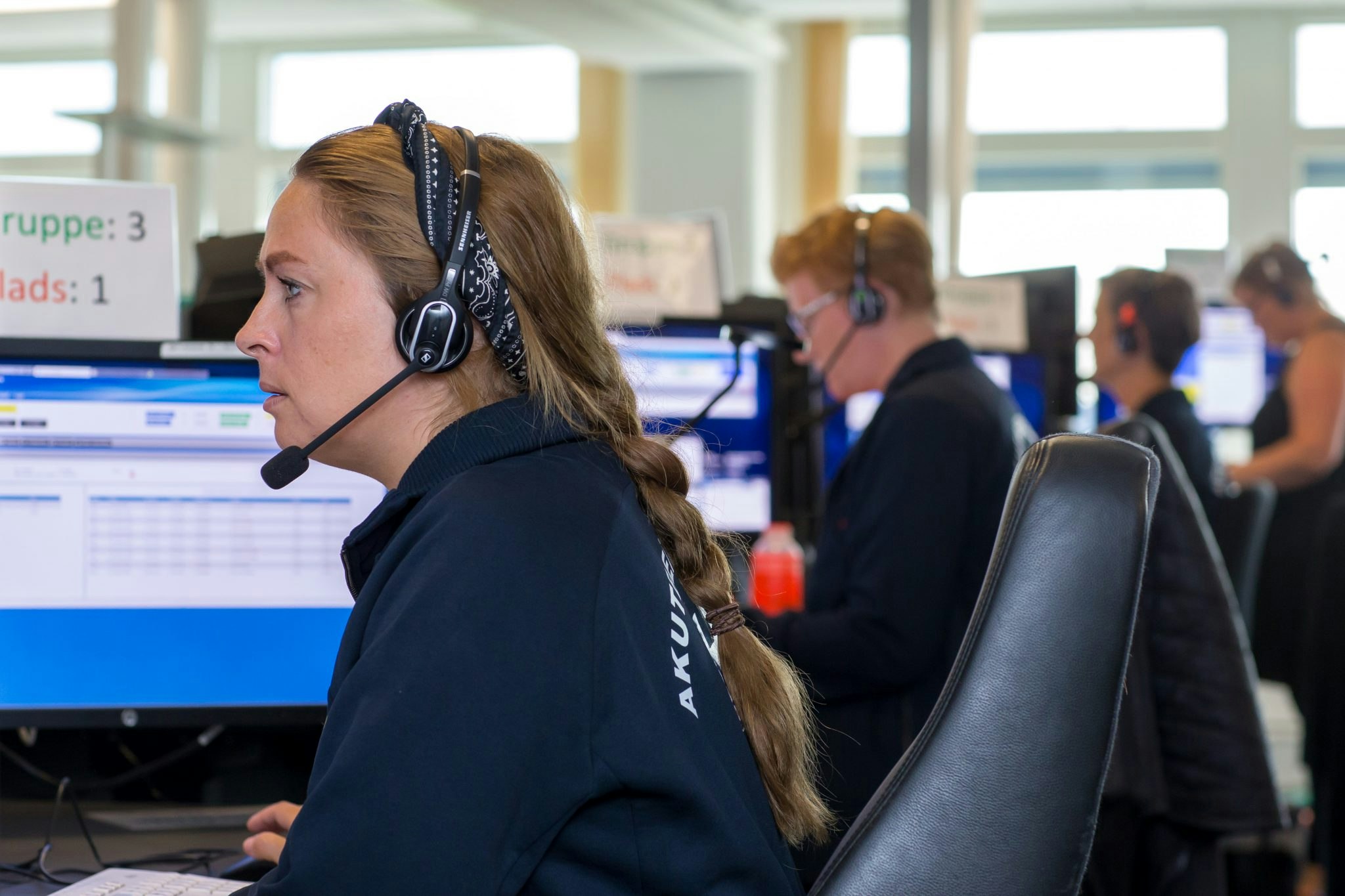Picture of responders taking calls at Denmark's emergency helpline