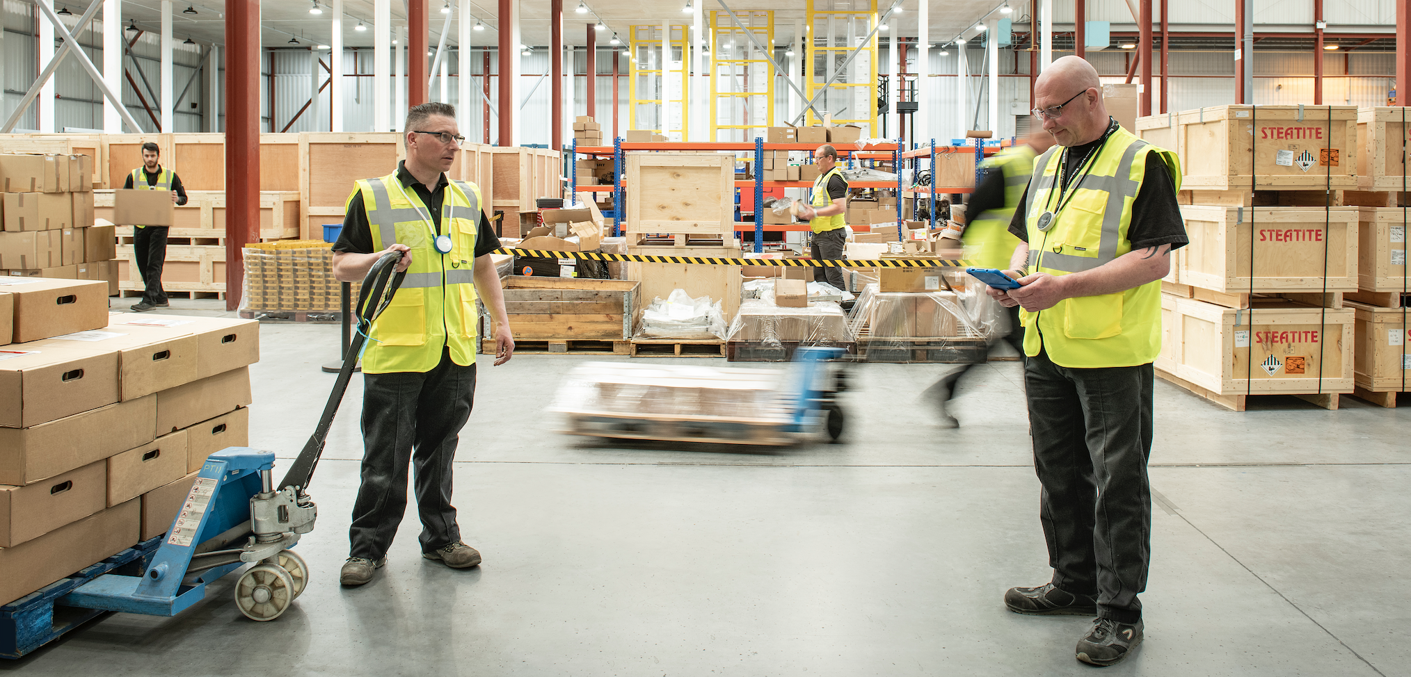 Men in a warehouse wearing Tharsus Bumps