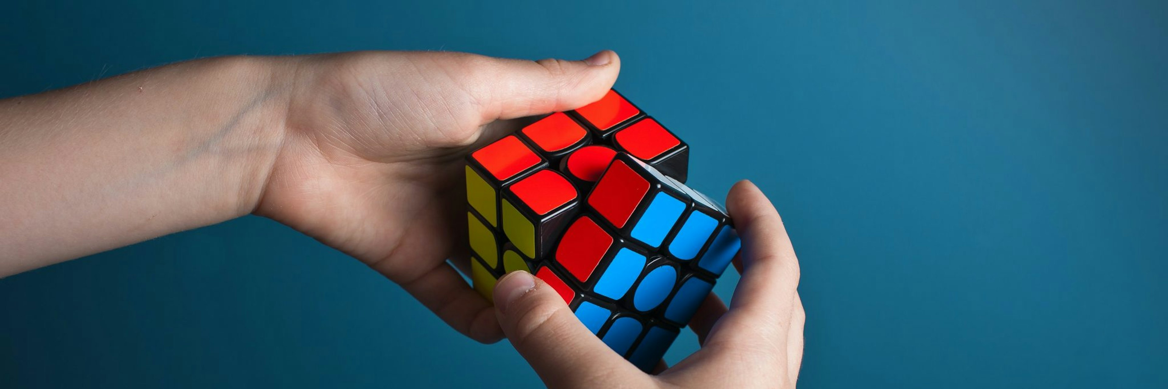 Hands doing a Rubik's cube