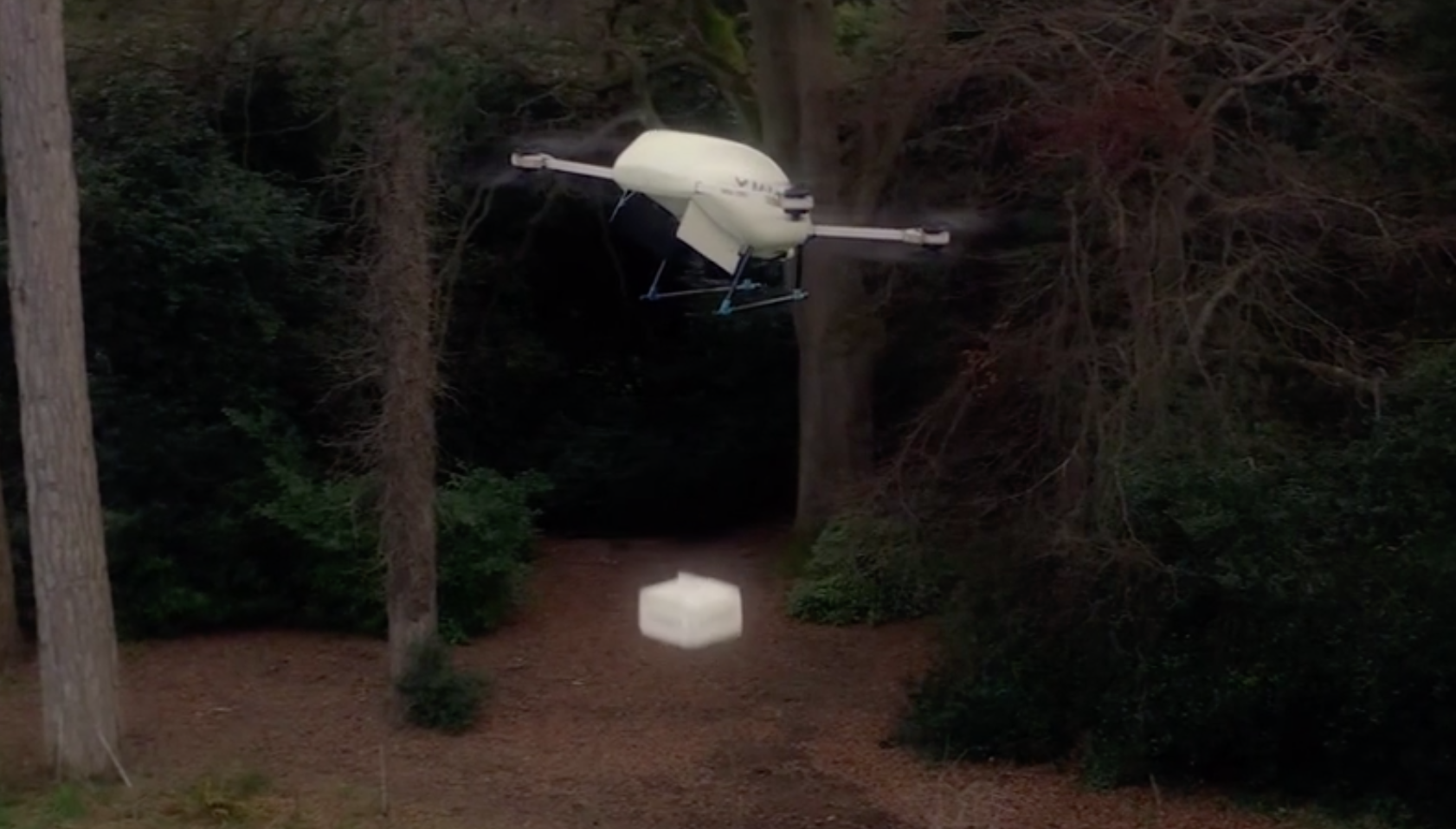 Manna drone lowering a package