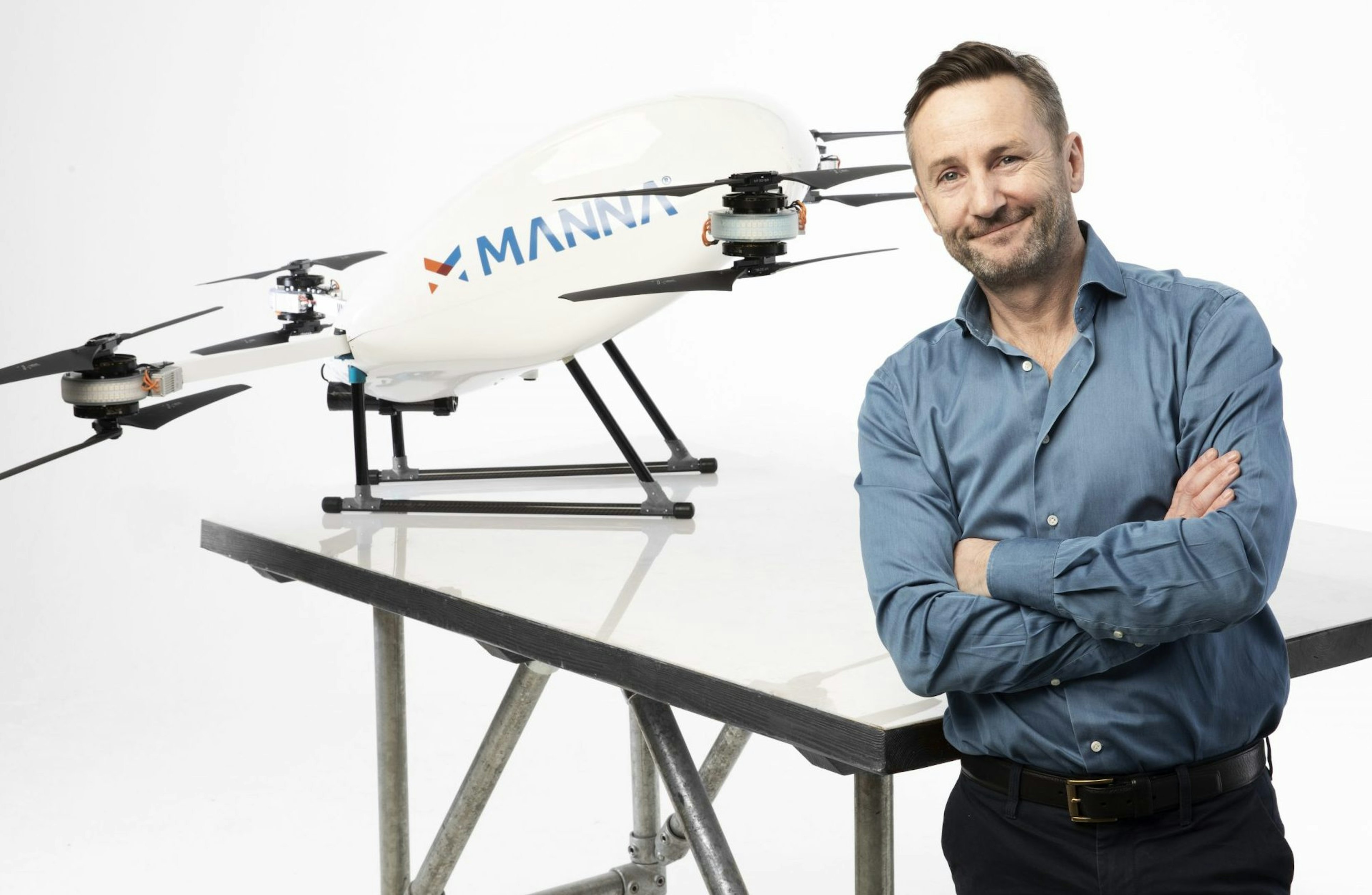 Manna founder and CEO Bobby Healy in front of a Manna drone
