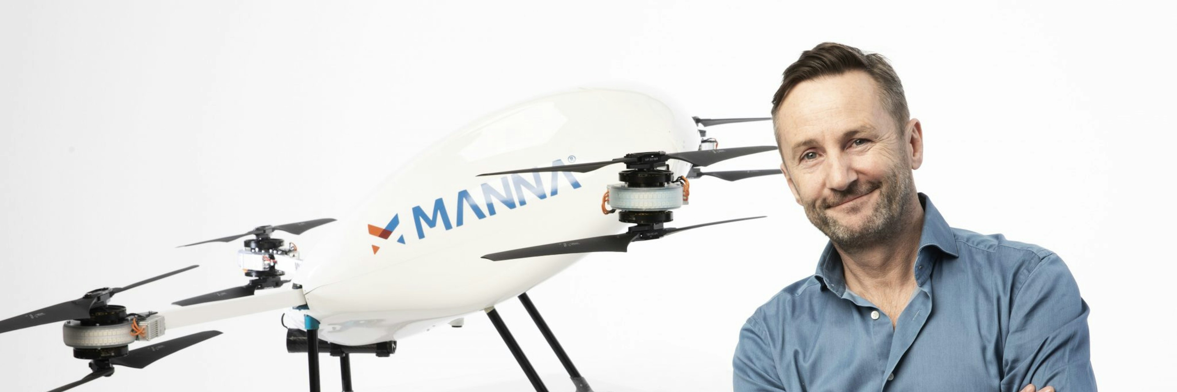 Manna founder and CEO Bobby Healy in front of a Manna drone
