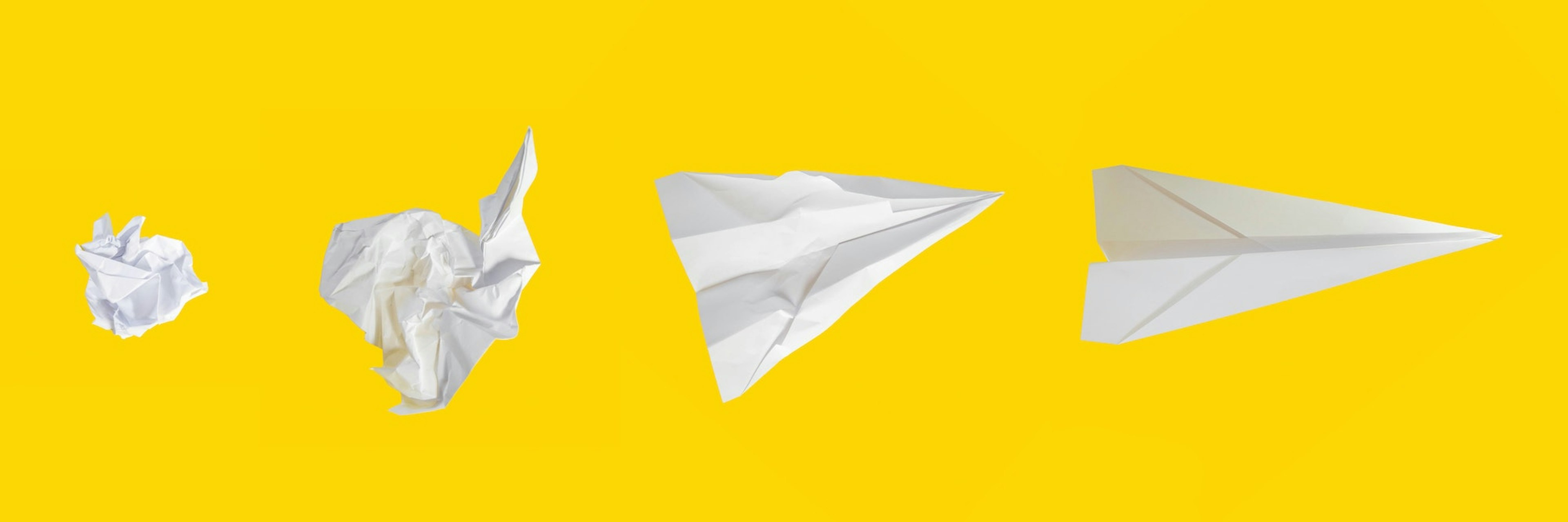 crumpled paper and paper airplane