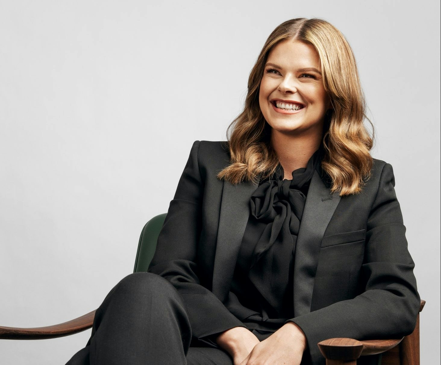 Linnea Kornehead sitting on chair smiling