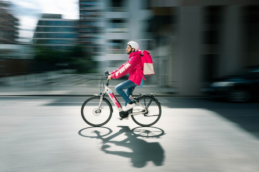 flink delivery man on bicycle
