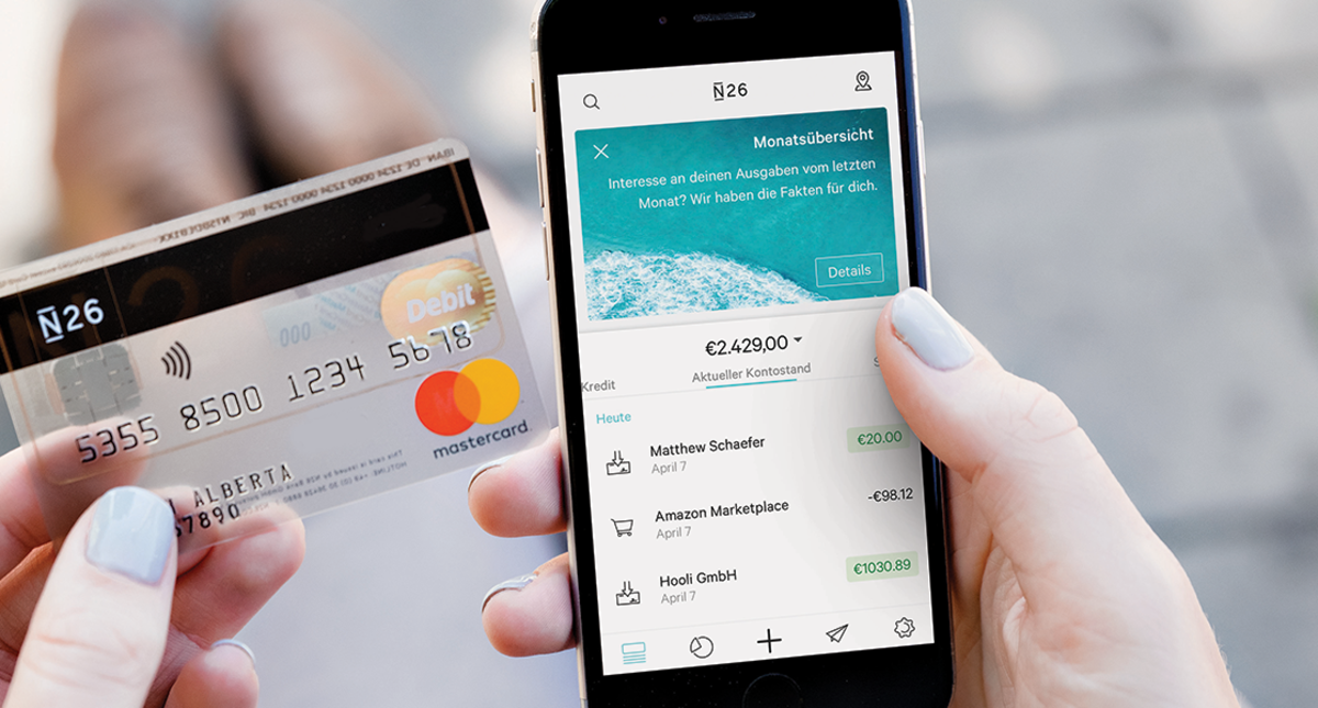 Person using an N26 bank card and app