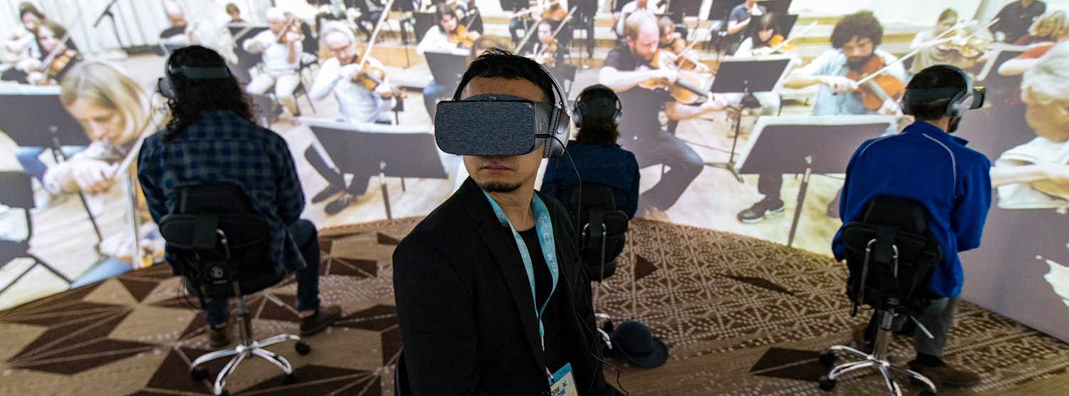 Using VR headsets and a surround sound system to mimic an orchestra playing live in the metaverse