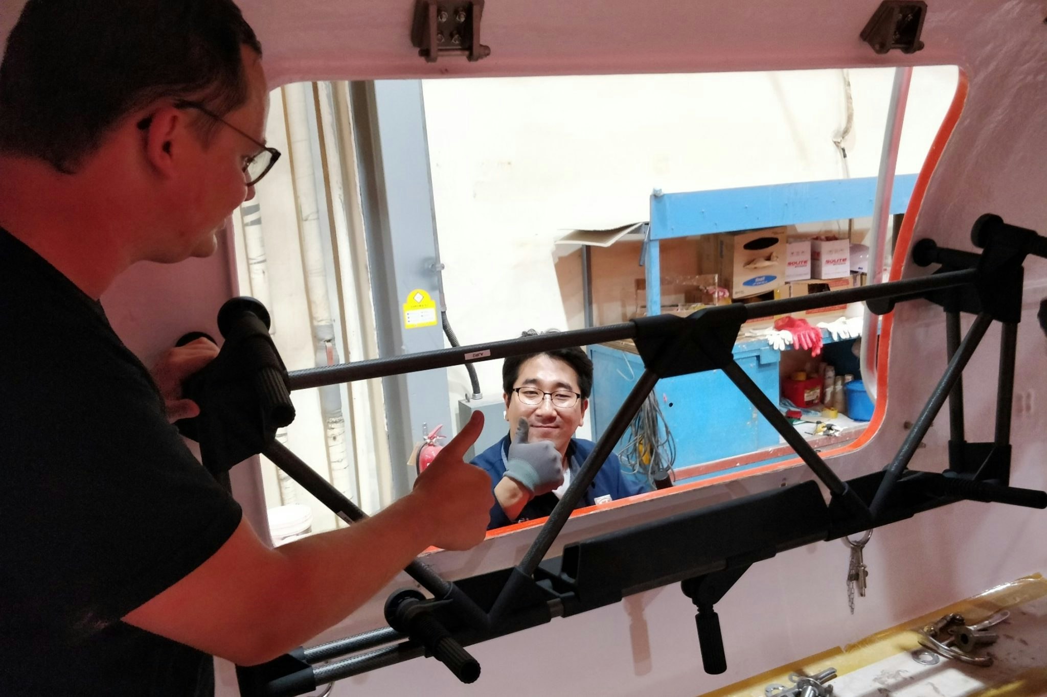 The Materialise team working on a lifeboat