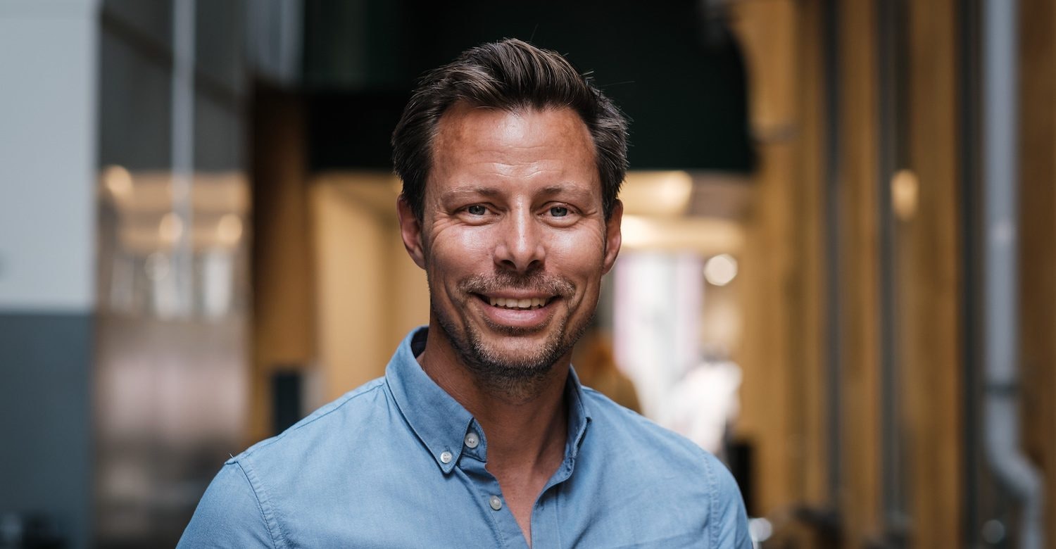 A headshot of Dixa cofounder Mads Fosselius, who explains the secret to startup M&amp;A strategy