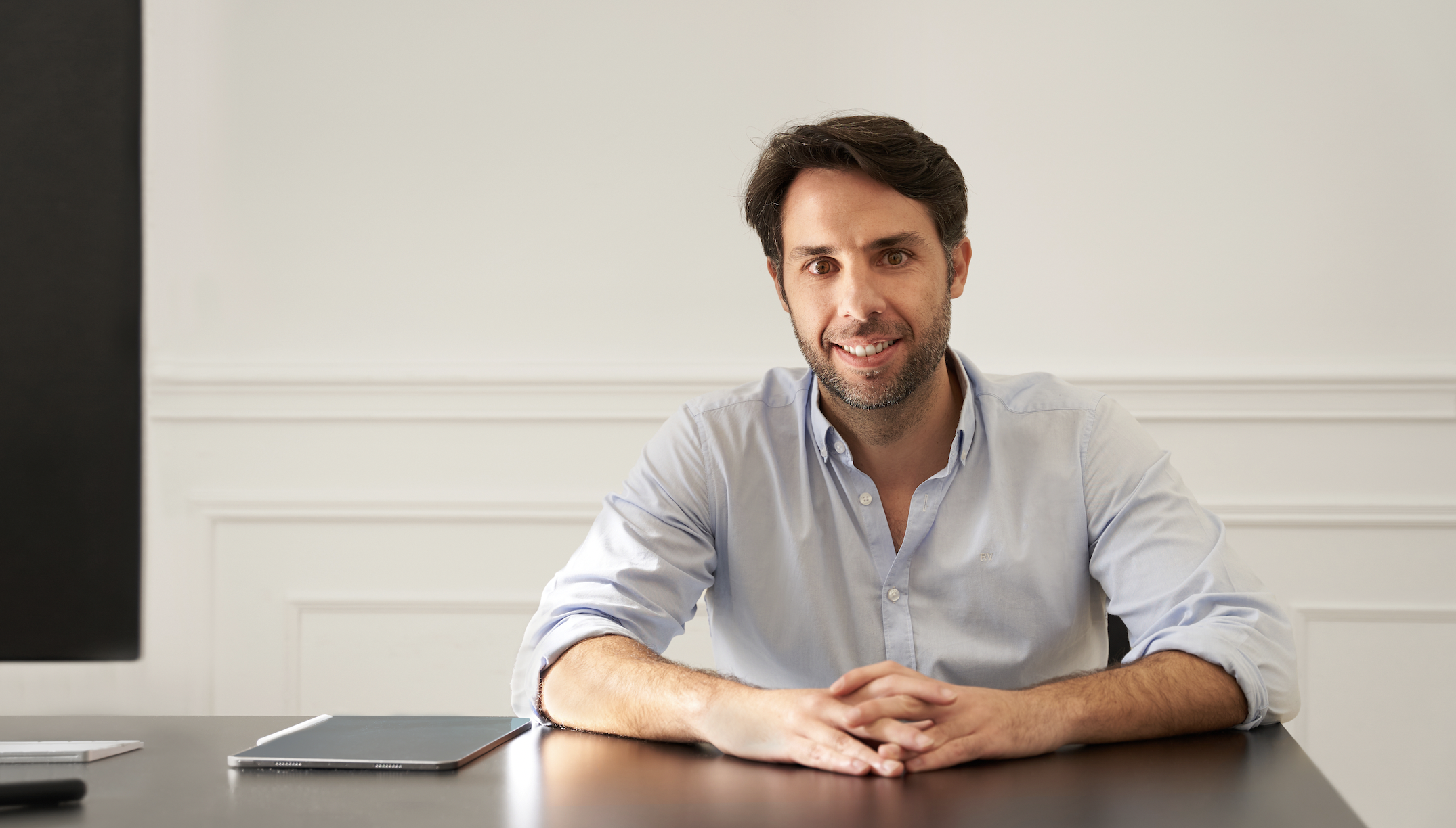An image of ODILO founder, Rodrigo Rodríguez, sitting at a desk