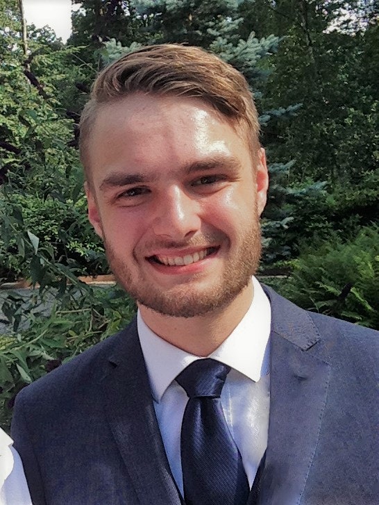 A man in a suit outdoors