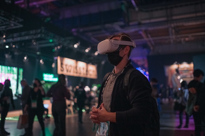 An image of someone wearing a VR headset at Slush