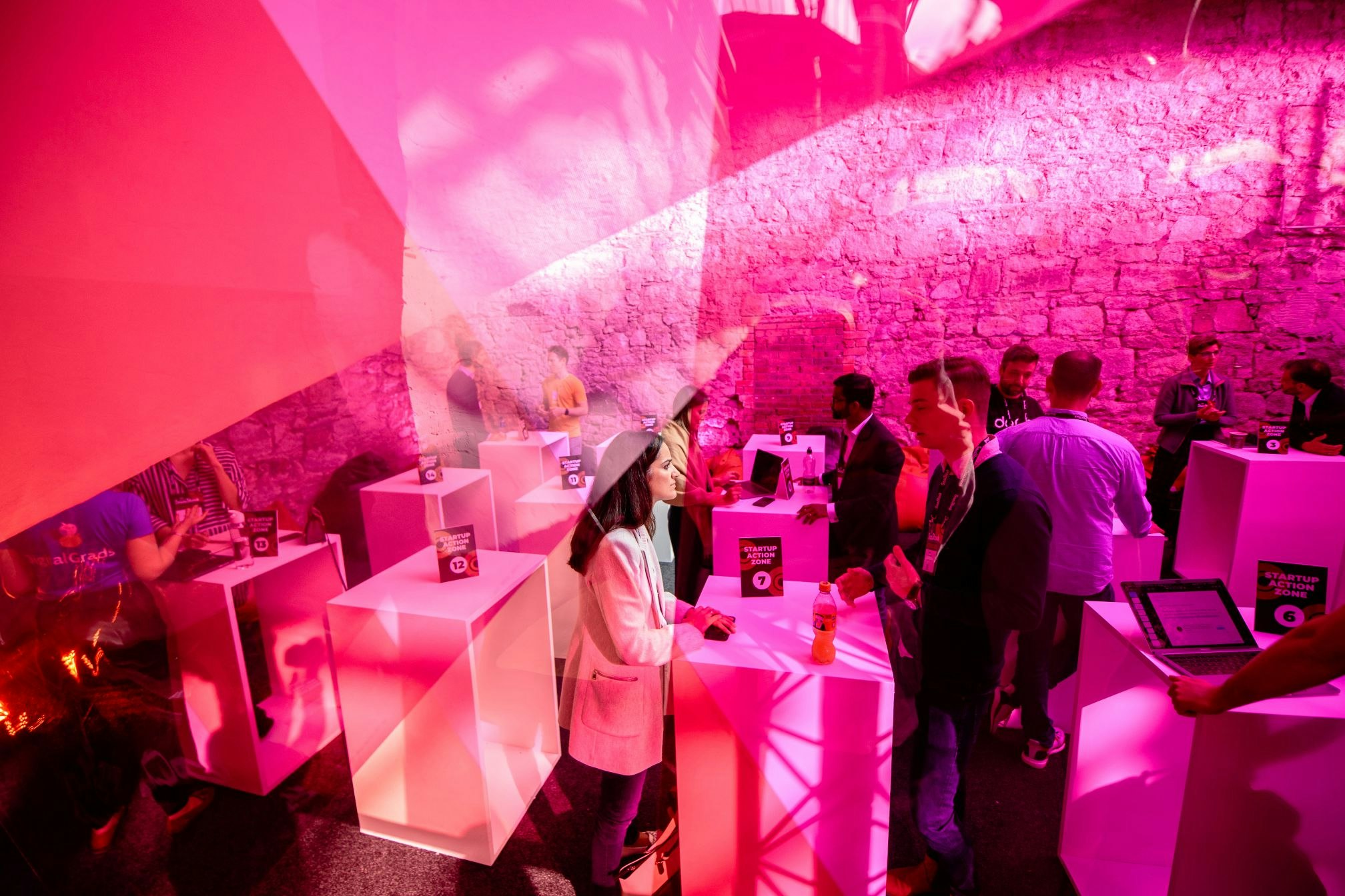 An image of people networking at the startup conference SaaStock, one of the tech conferences to attend in 2022