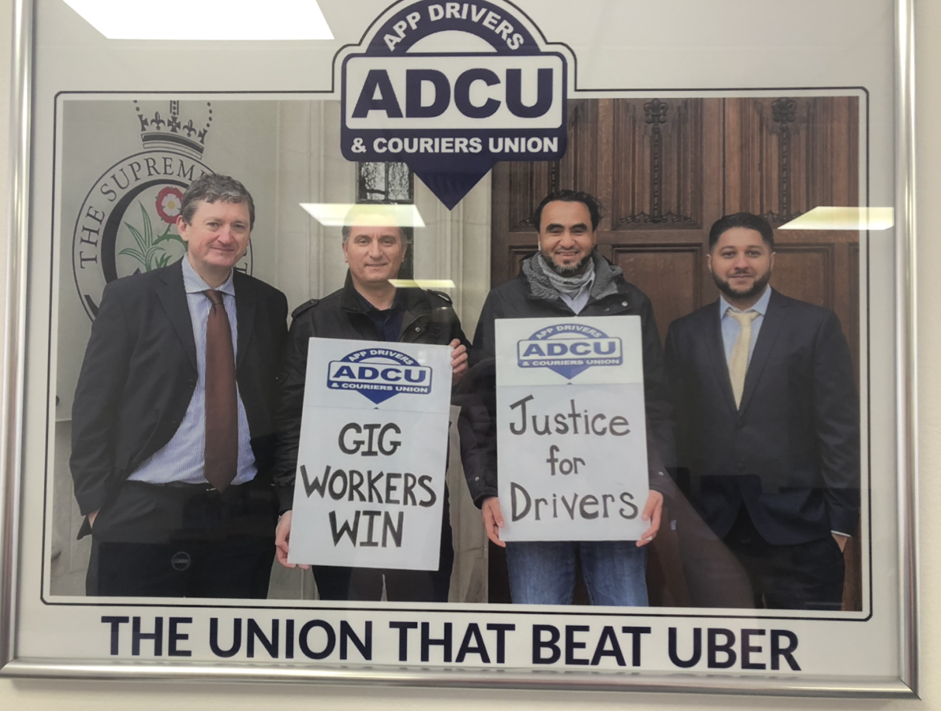 A framed photo in the ADCU office of the union's winning court case