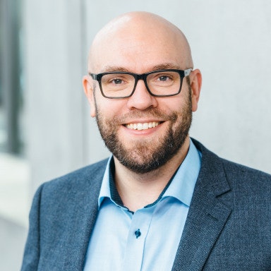 A headshot of a smiling Johan Lilliestam, professor of energy transitions and public policy at the Institute for Advanced Sustainability Studies in Potsdam, Germany.