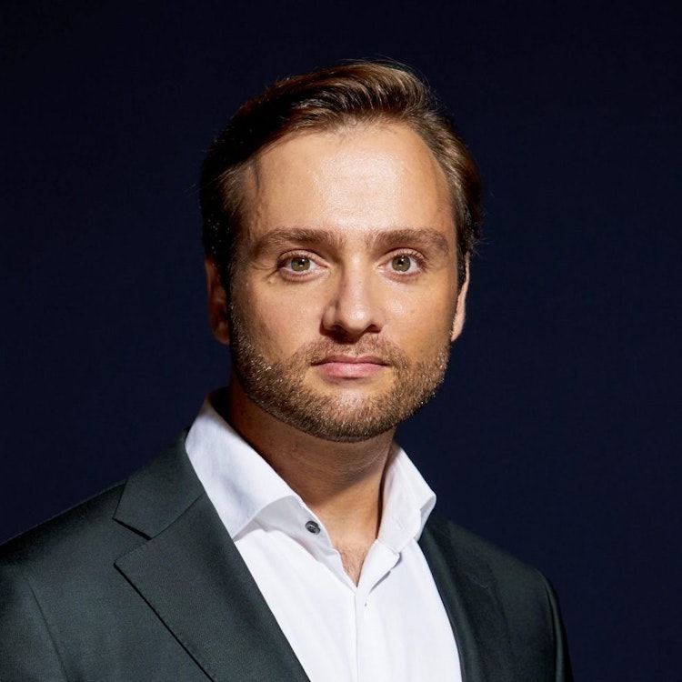 A landscape photo of Sven Jungmann against a dark black background