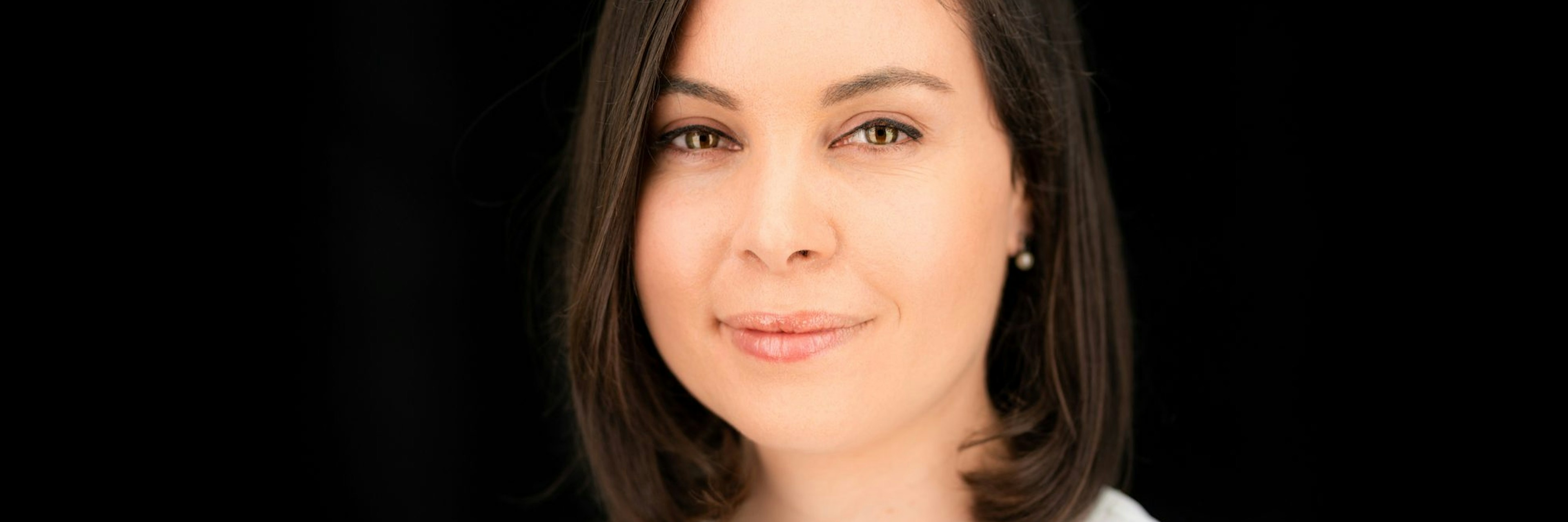 Headshot of Melina Sanchez, principal at AENU