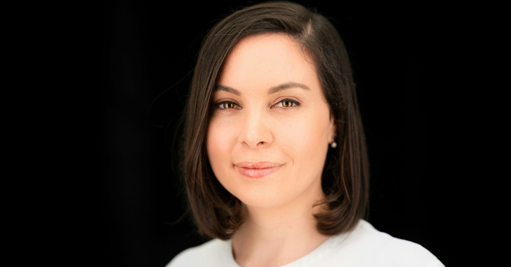 Headshot of Melina Sanchez, principal at AENU