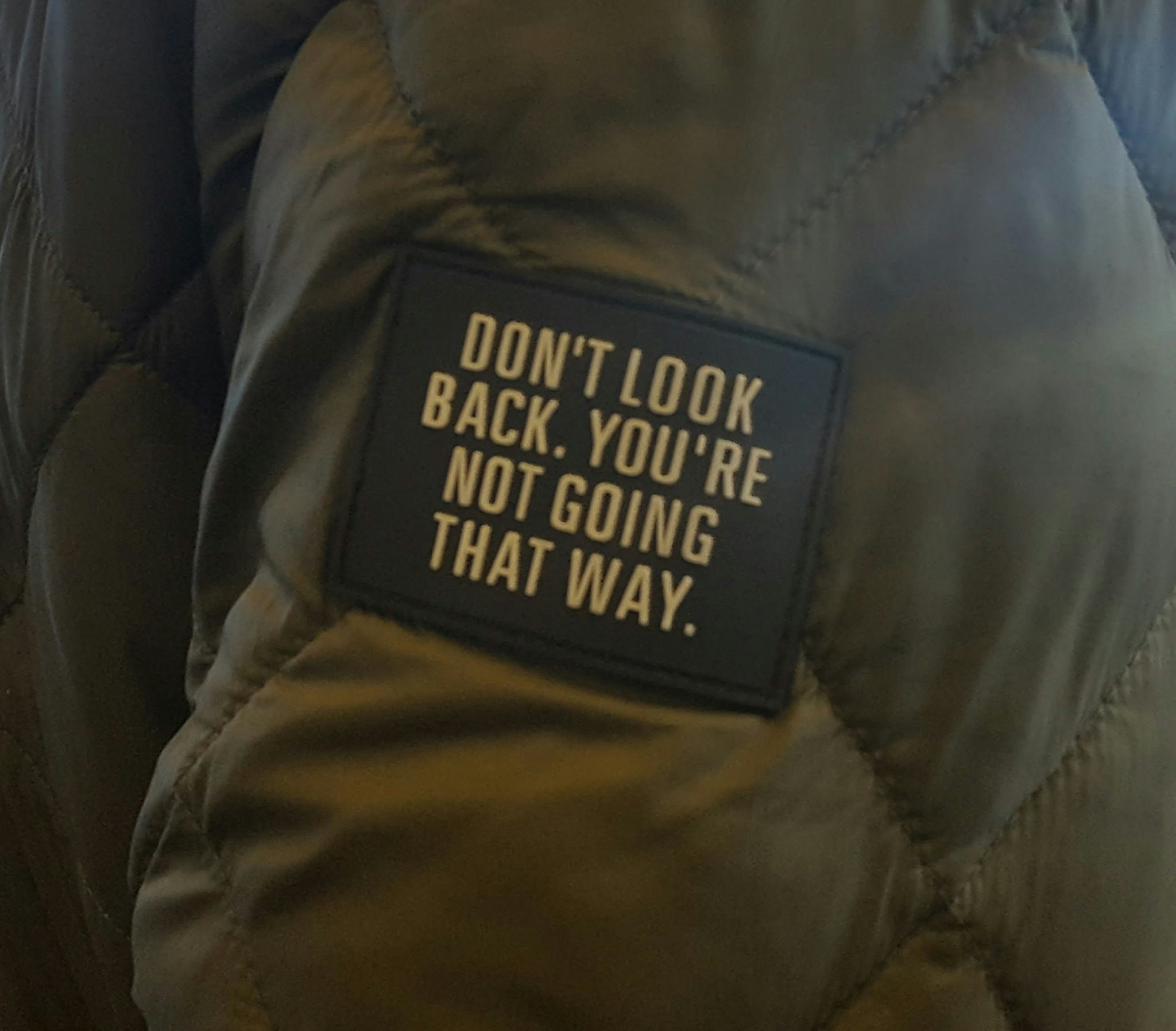 “I took the attached picture years ago at an airport (a man was wearing a jacket with a patch). It helps me keep moving forward in my own creative journey and in my career. It could help others who were laid off stay positive and focus on what's ahead.”