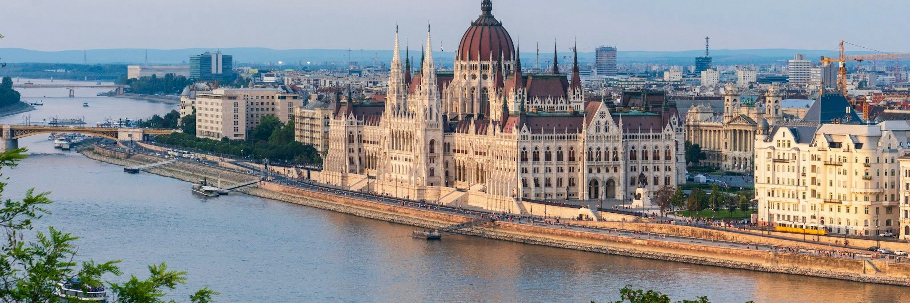 The big parliament building standing at the riverbank in Budapest