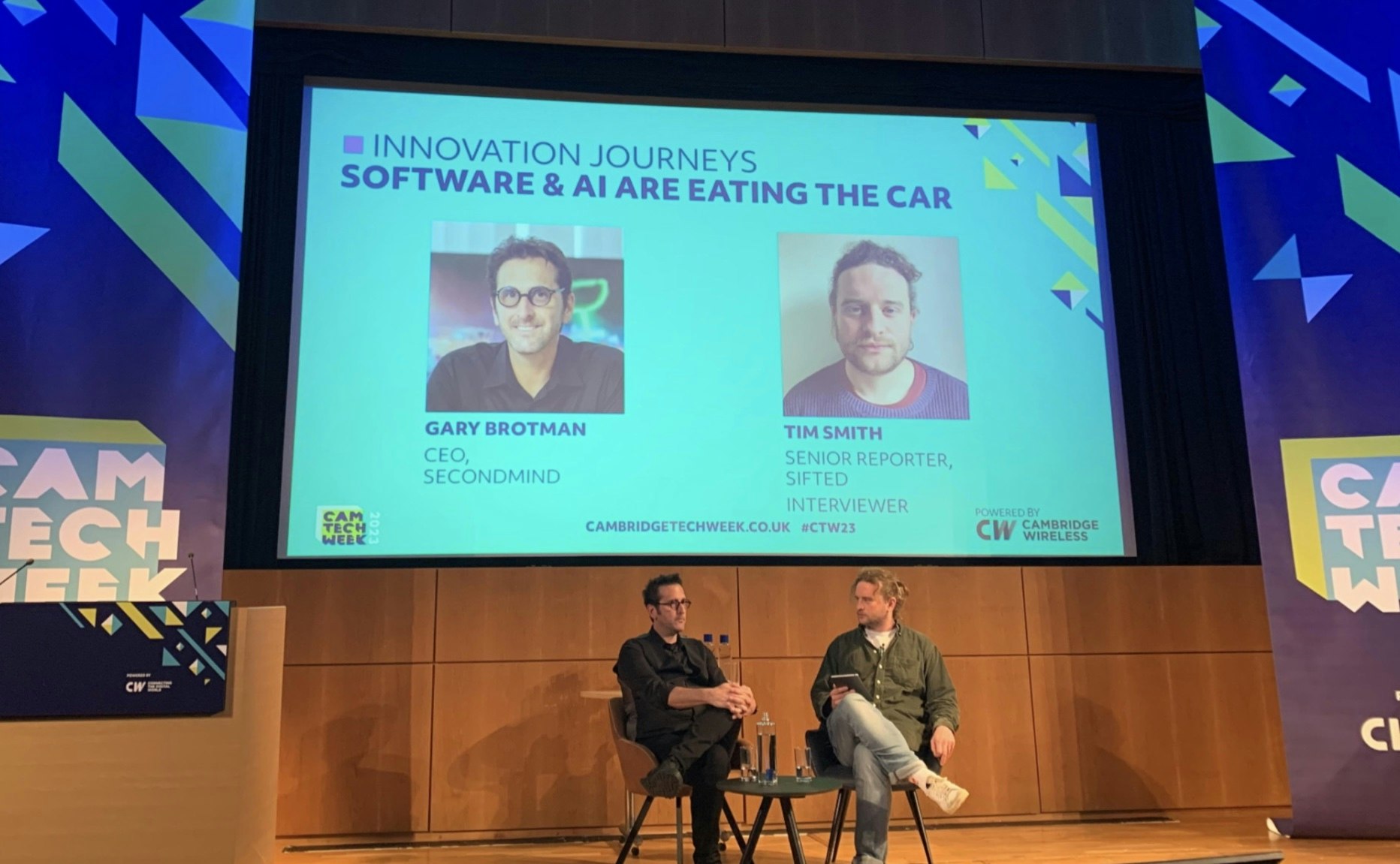 An image of Tim Smith and Gary Brotman on stage at the Cambridge Tech Week