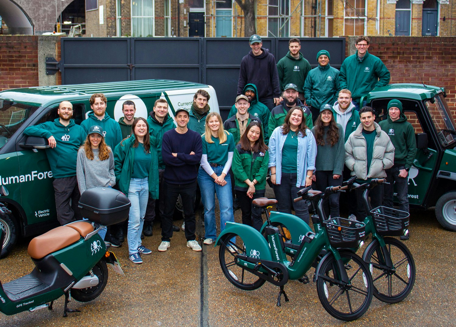 A team photo of HumanForest, some of which are wearing green jumpers