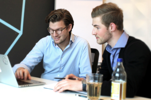 A photo of Weber and N26 cofounder Valentin Stalf working at a laptop