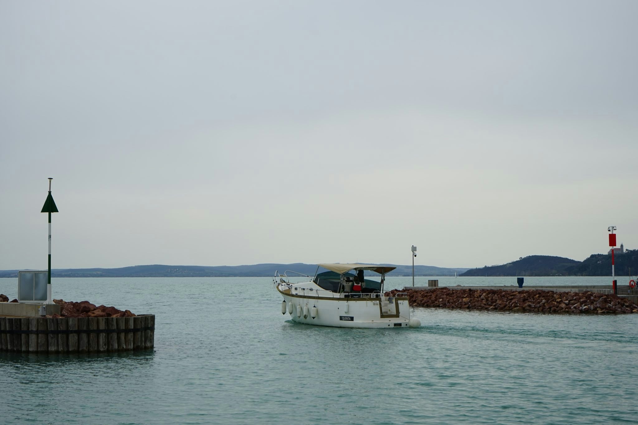 A boat leaves a small port on Lake Balaton in Hungary.