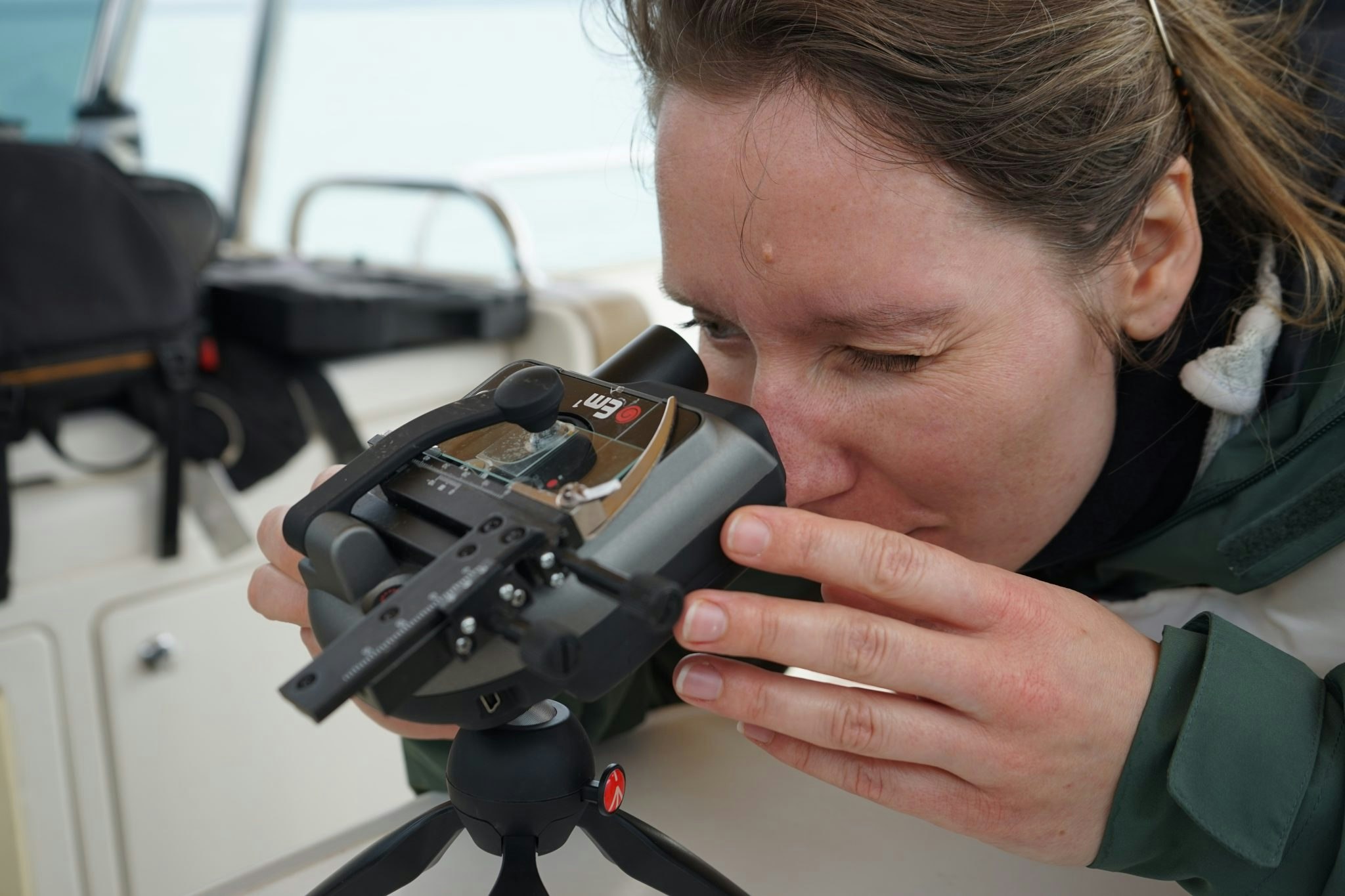 Basecamp's Ineke Knot looks through a microscope at Plankton. 