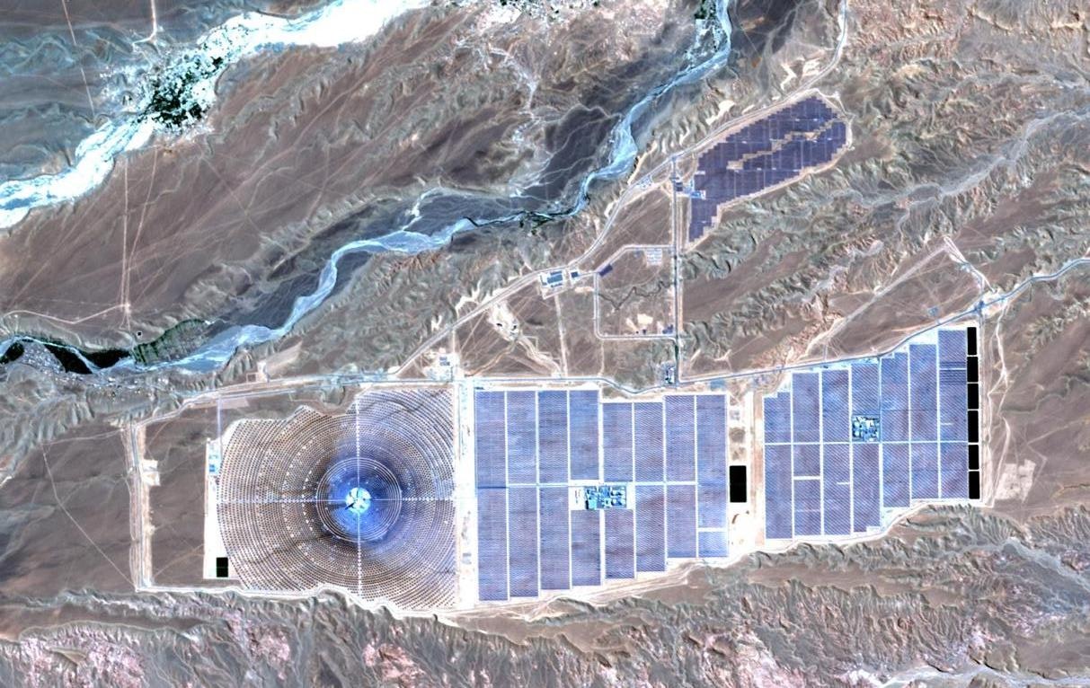 A satellite image of thousands of solar panels in the desert