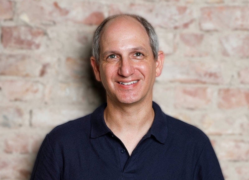 Headshot of Yair Reem, Partner at Extantia Capital, standing in front of a brick wall.