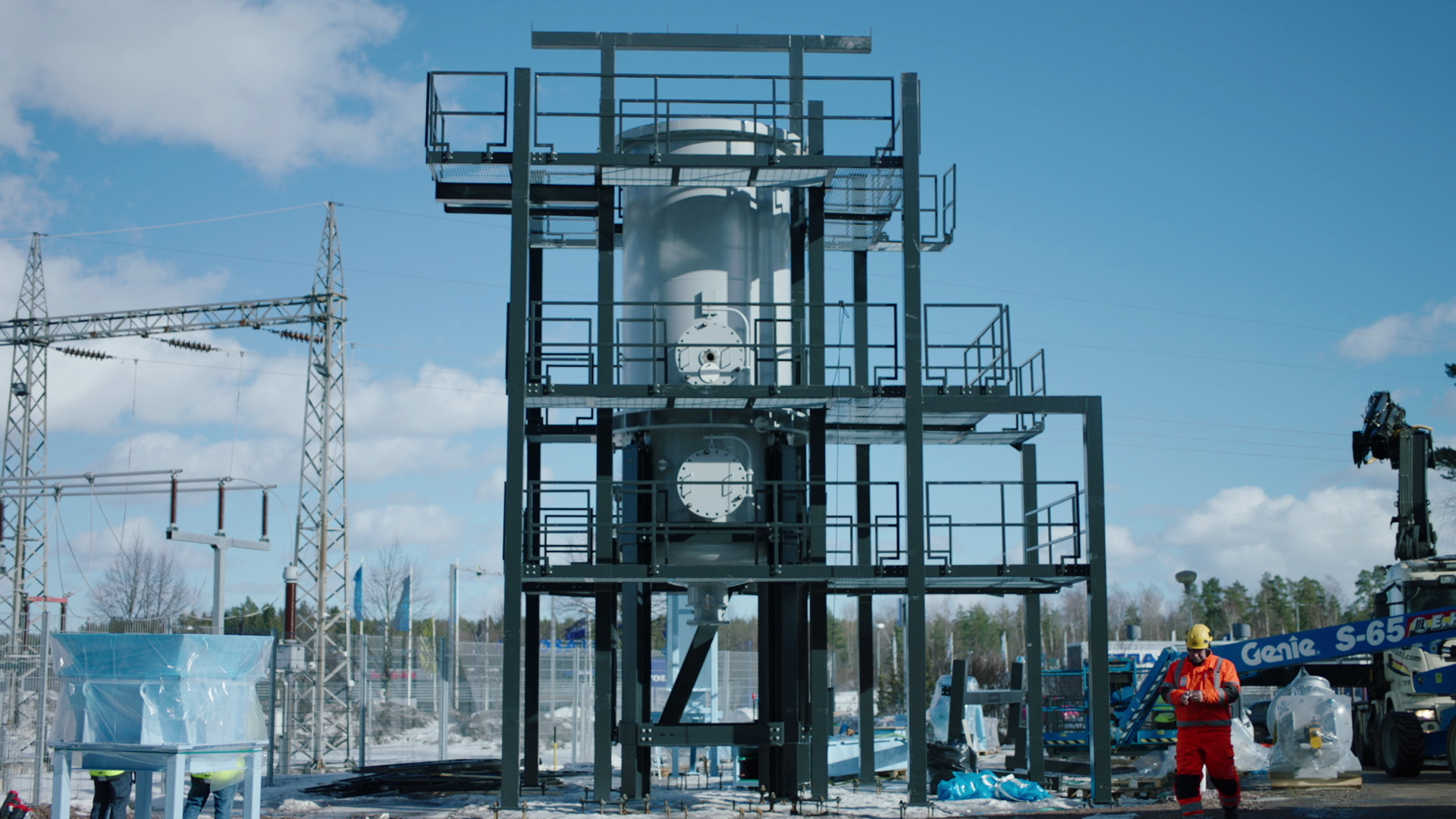 An image of scaffolding around a metal silo-looking device