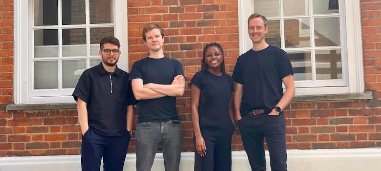 The Form Ventures team standing against a red brick wall.