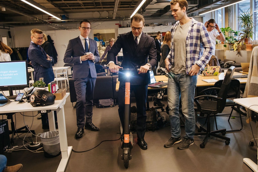Voi founder Fredrik Hjelm showing Prince Daniel of Sweden how to use an electric scooter.