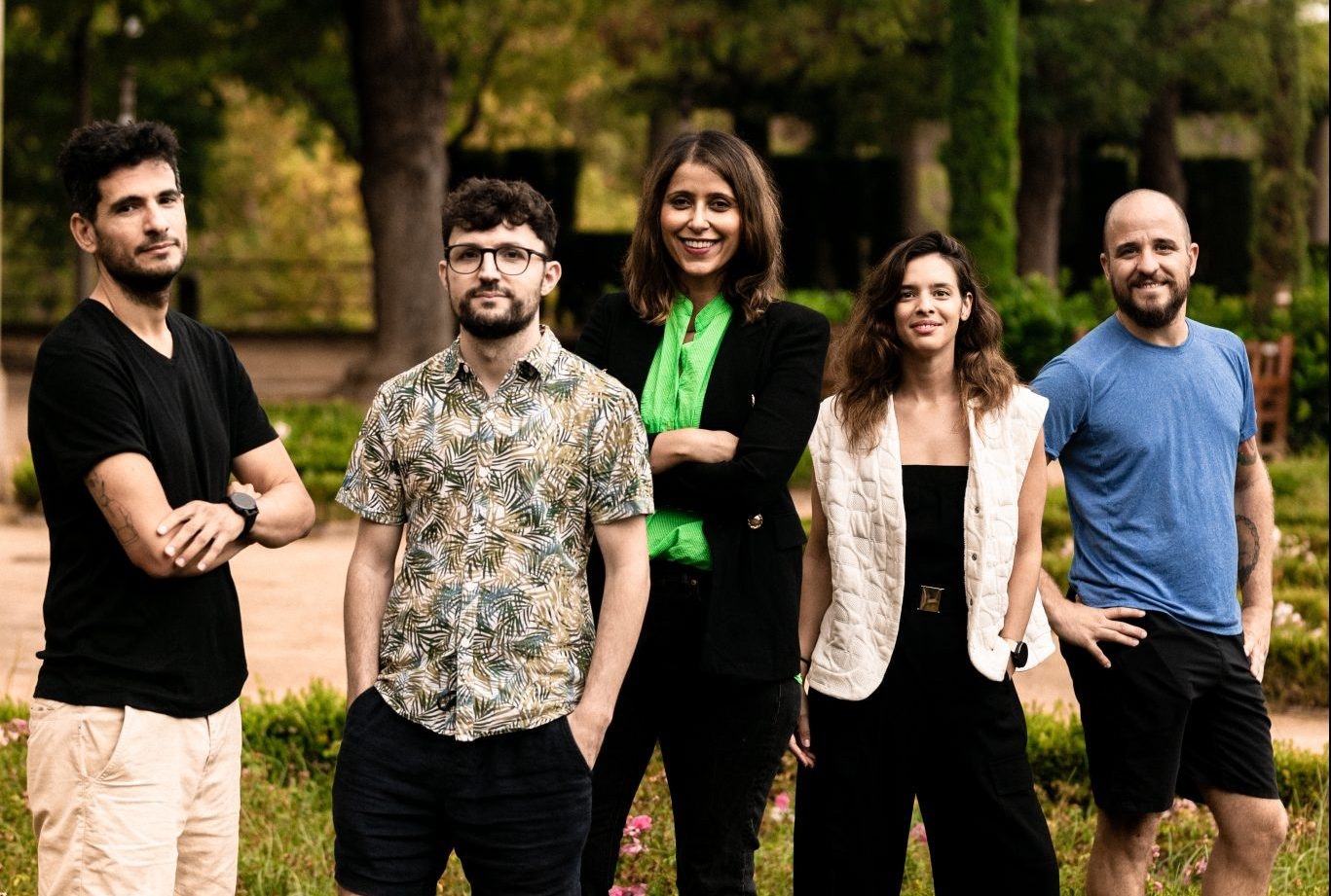 A corporate shot of the Opna team posing in a park.