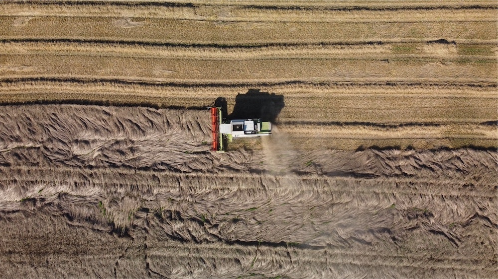 A farming vehicle ploughing a field, getting it ready for regenerative agriculture.