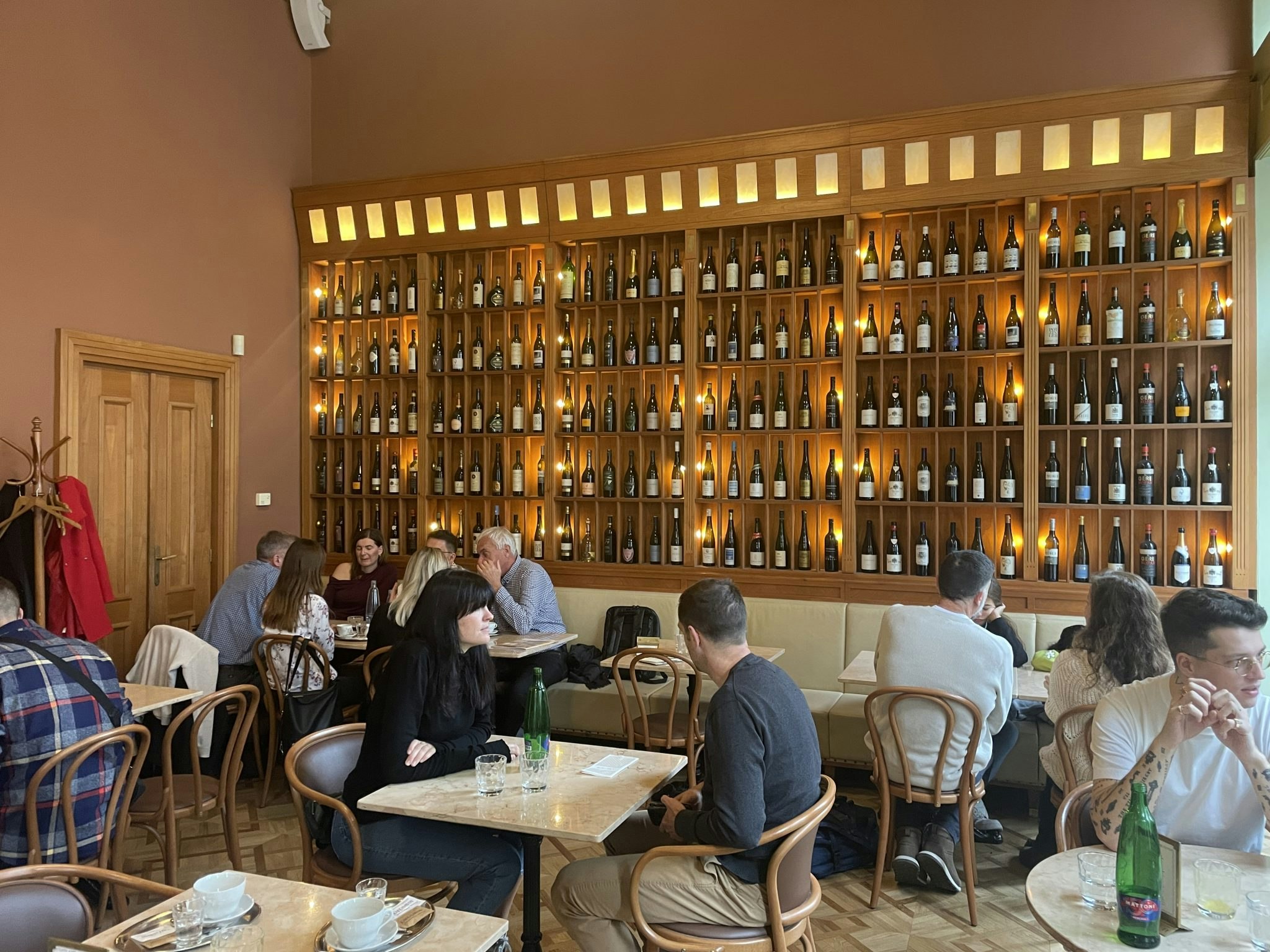 People sat down eating at the Cafe Savoy.