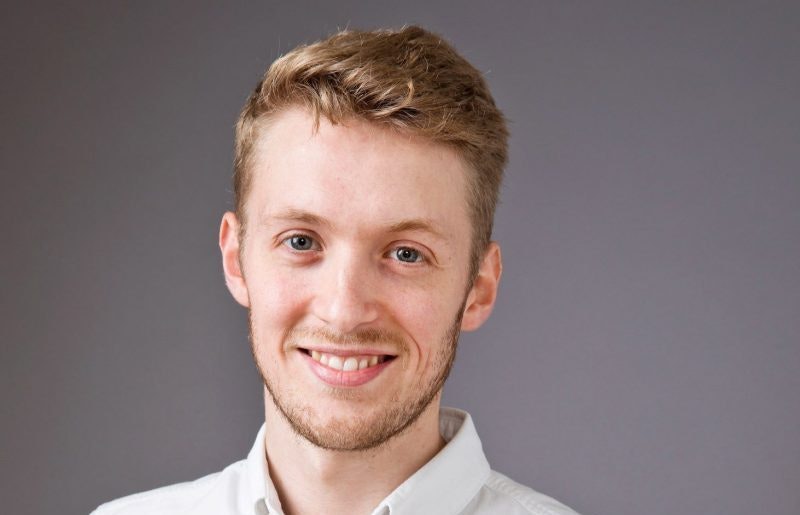 A headshot of Jeff Pole against a grey background