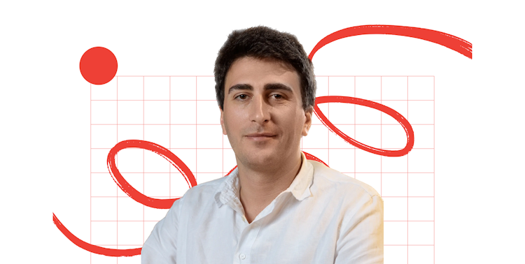 Headshot of Sandro Okropiridze against a white and orange graphic background