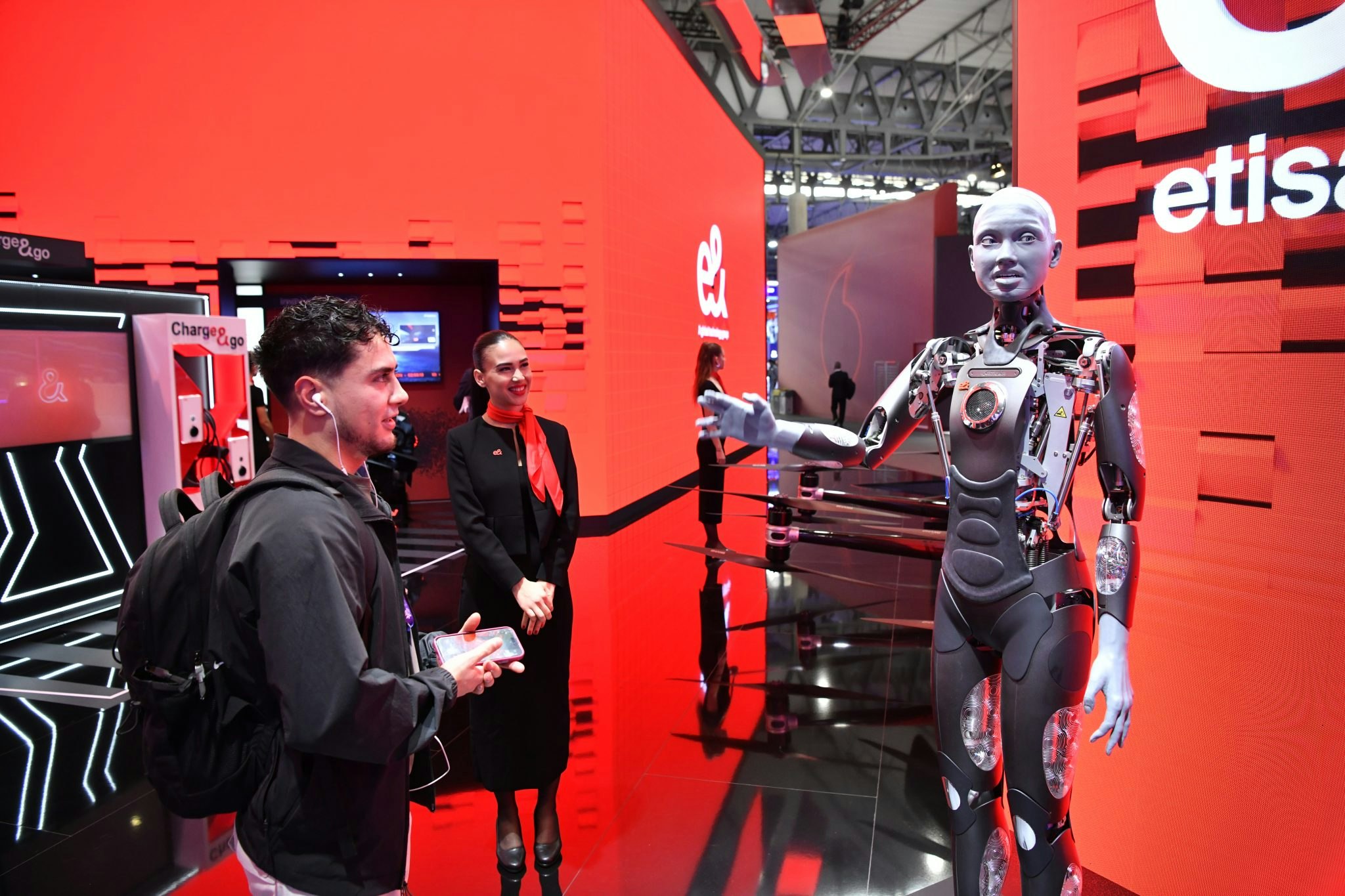 A robot greeting a human at the Mobile World Congress in Barcelona