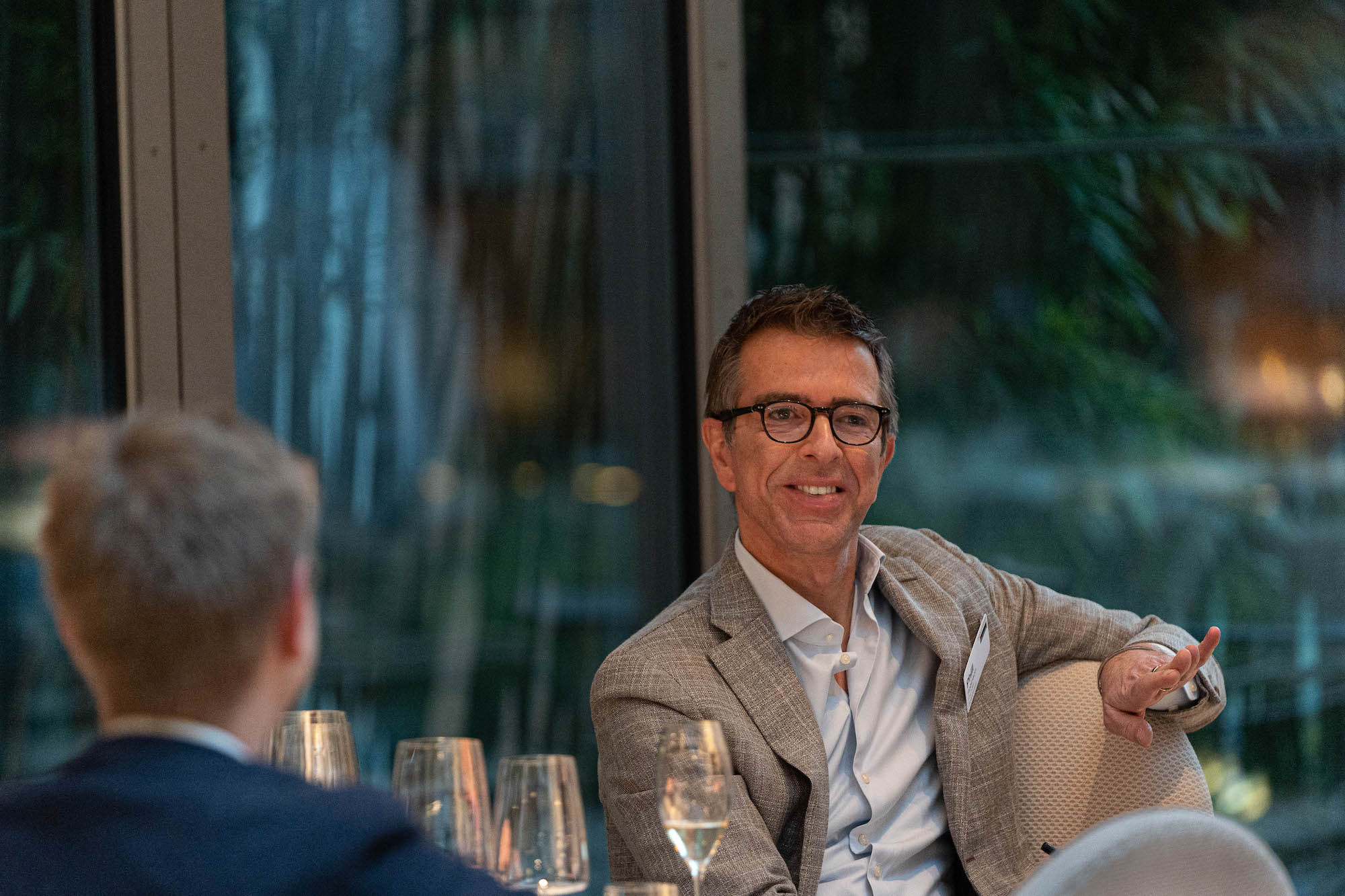 Phill Robinson, CEO and cofounder at Boardwave, sitting at a table with another man.