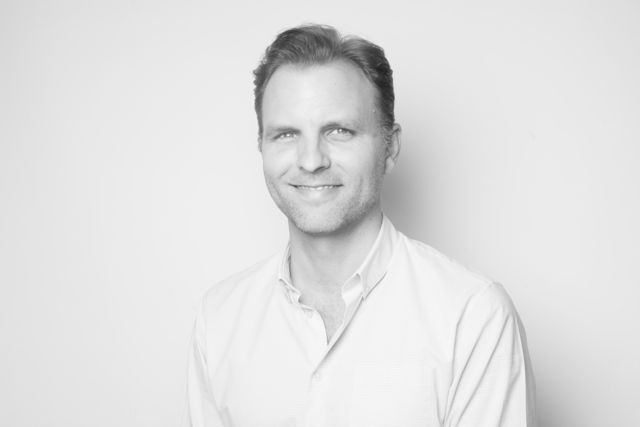 A headshot of Ron Ivey.