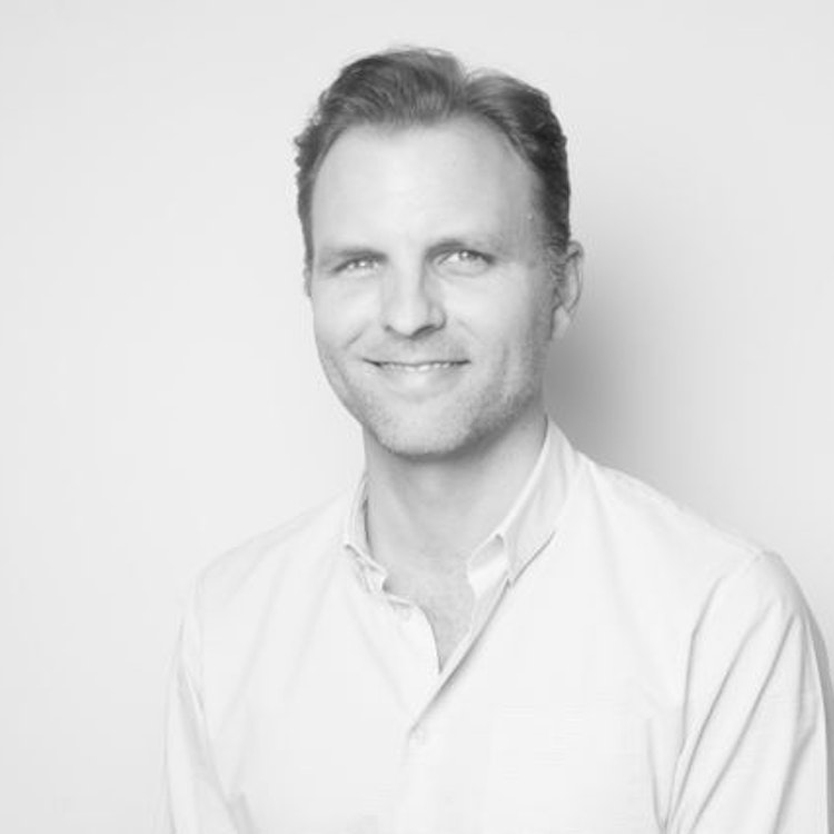 A headshot of Ron Ivey.