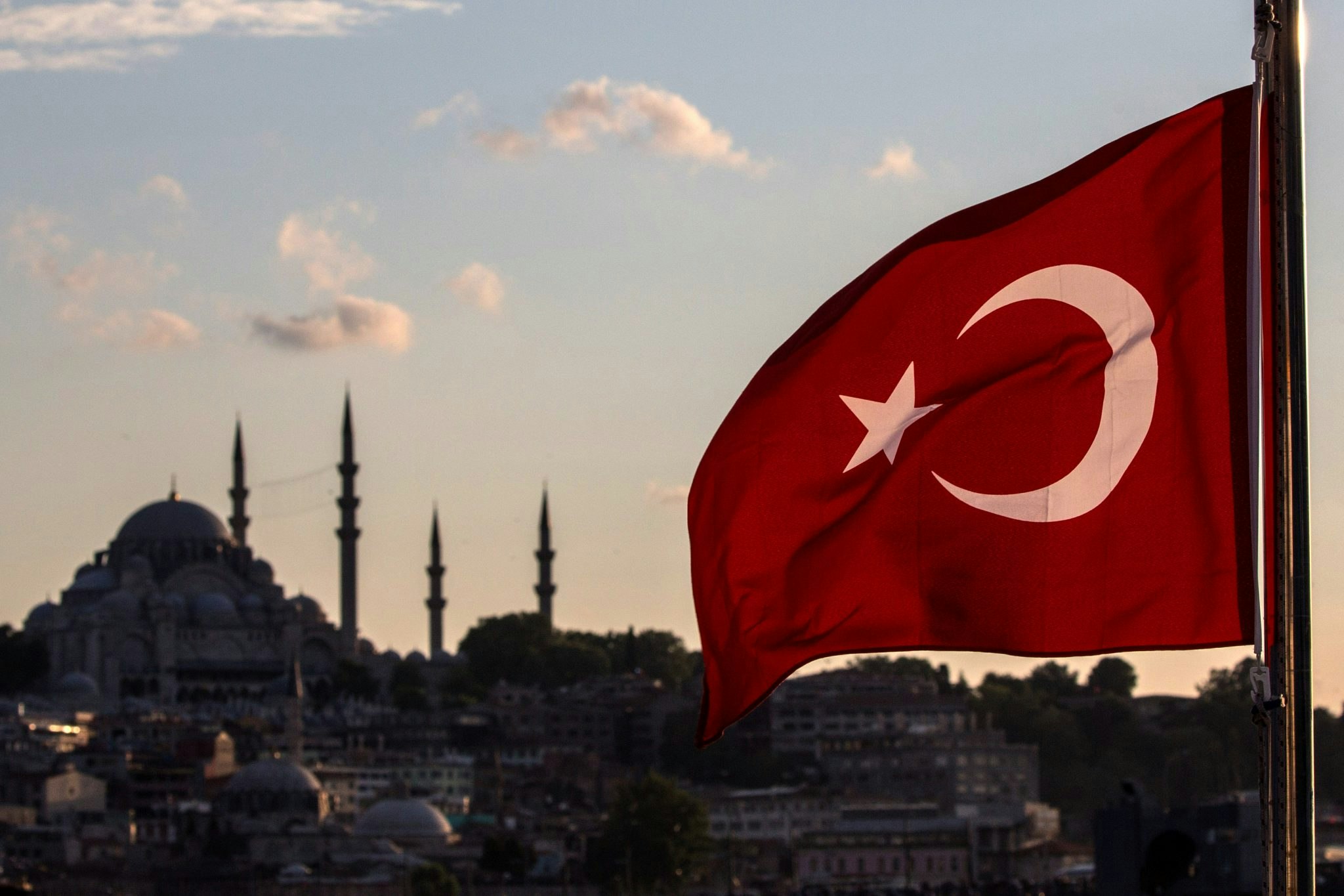 The Turkish flag is seen in front of the Istanbul skyline on the third day of celebrations for Eid al-Fitr at Kadikoy on July 7, 2016 in Istanbul, Turkey. Eid al-Fitr is a three-day festival of feasting and celebration marking the end of the muslim holy fasting month of Ramadan.